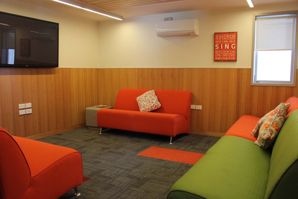 Boarding house TV room with sofas