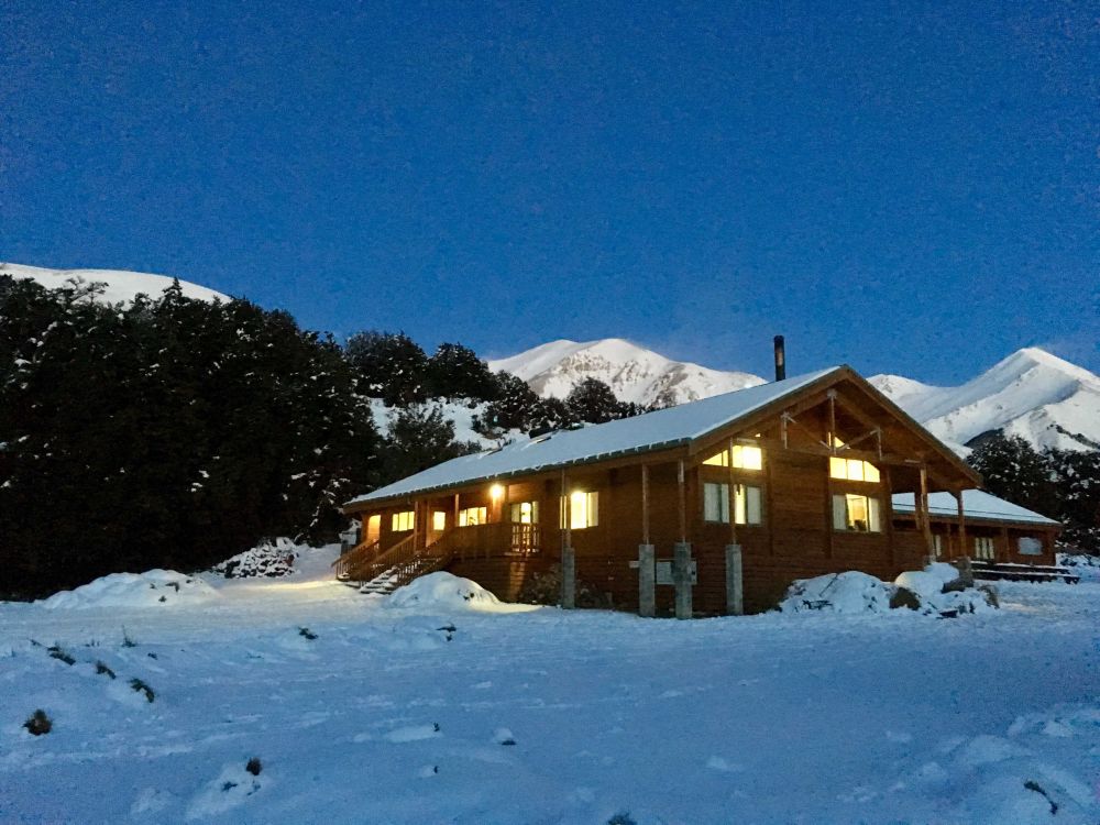 Castle Hill lodge in the snow at dusk