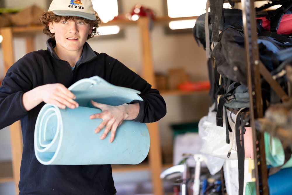 Student in the gear room at Castle Hill