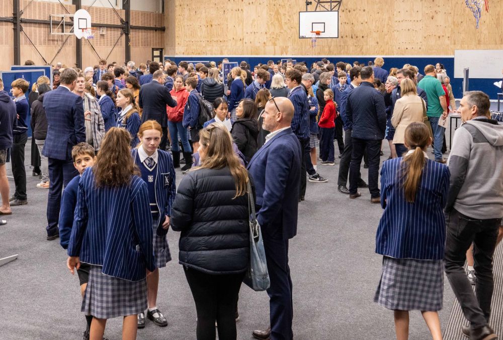 Gym 1 interior with families and students at an event