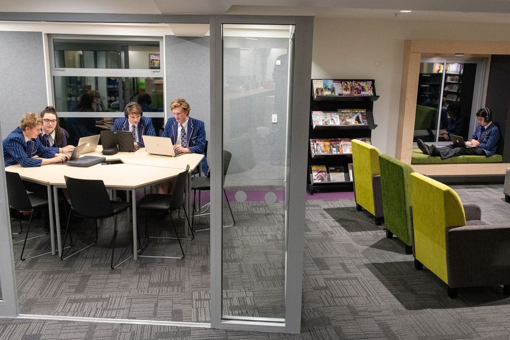 Students in the Green Library and Innovation Centre working on laptops