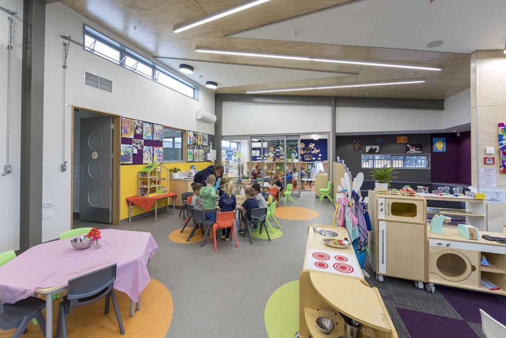 Pre-school children working with teacher