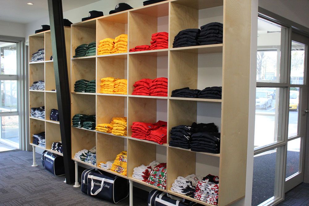 St Andrew's College shop Thistles interior with clothes on racks