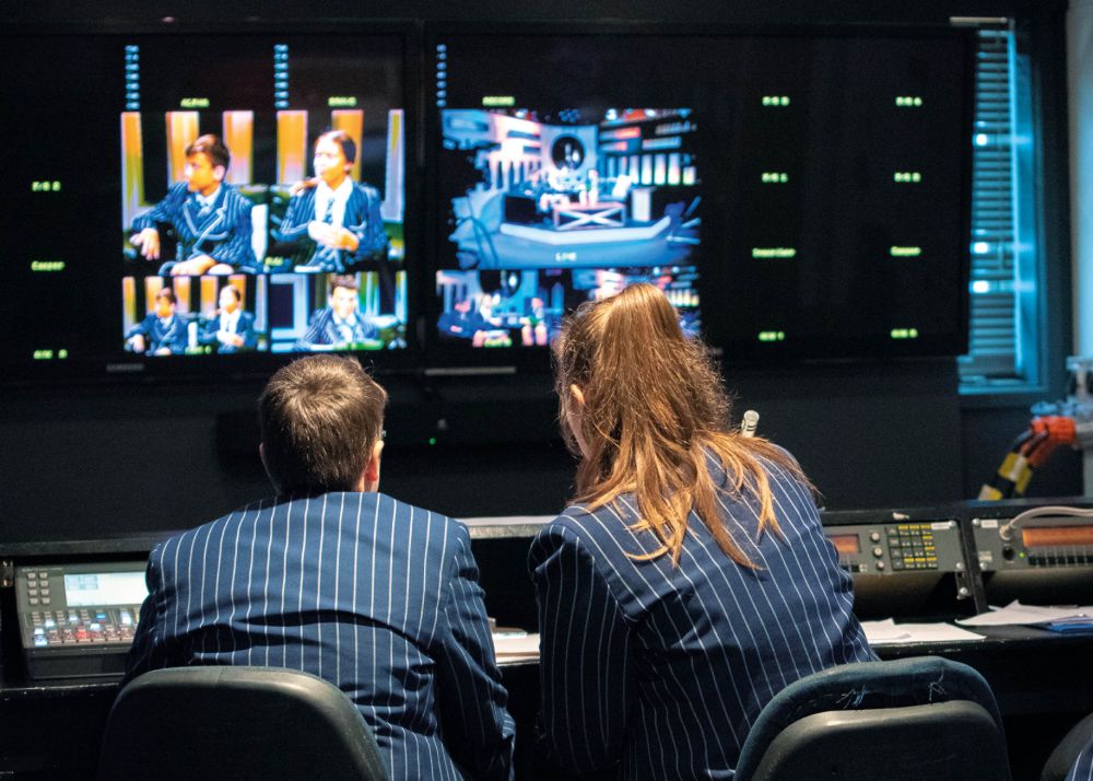St Andrew's College students at control desk in TV Media Studio