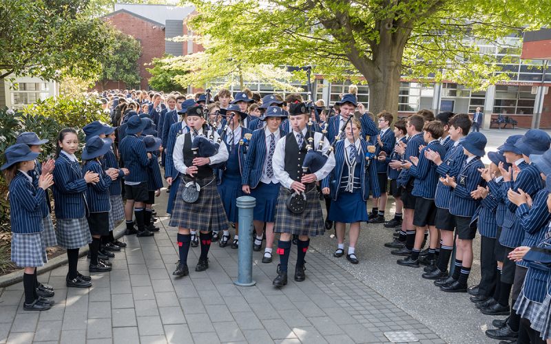 Secondary and Preparatory students parading through the school.