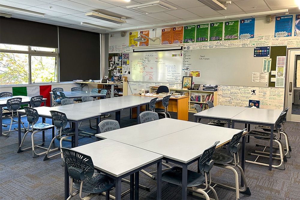 St Andrew's College classroom with desks, chairs and two whiteboards