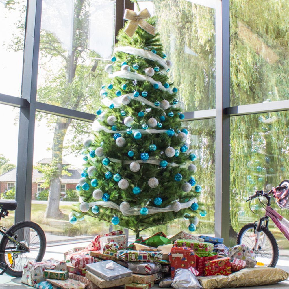 Christmas tree with presents in the Centennial Chapel.