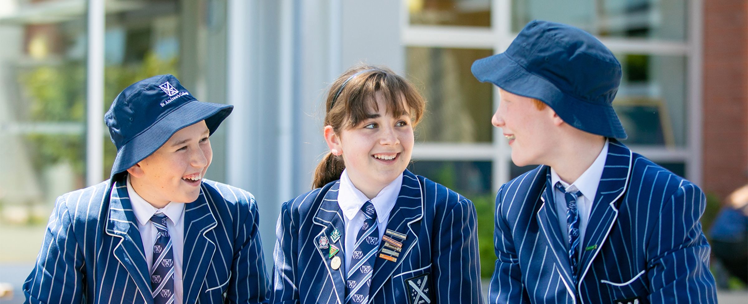 Co-ed students talking outside.
