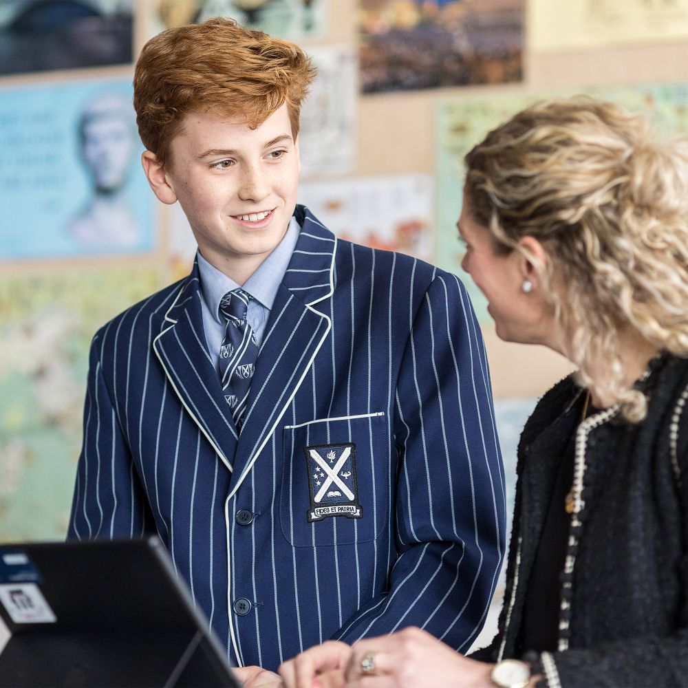 Student and teacher in a classroom.