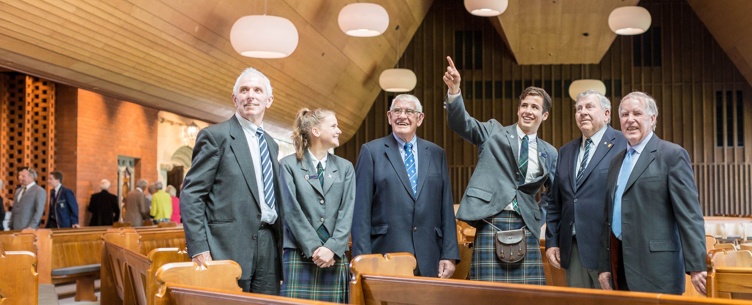 Prefects and Old Collegians in Centennial Chapel talking
