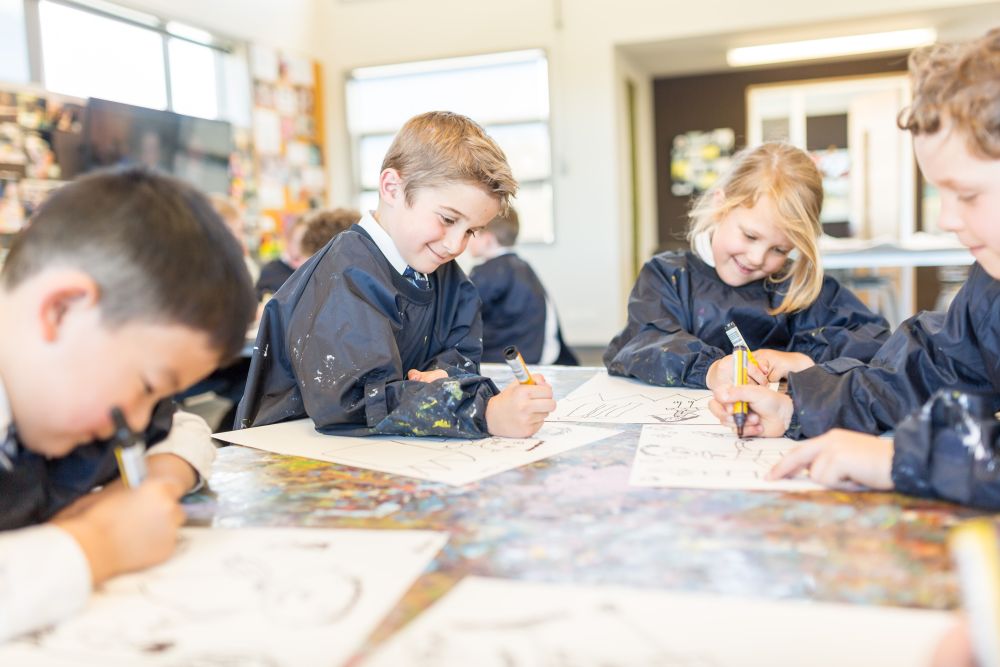 Prep school children in art lesson