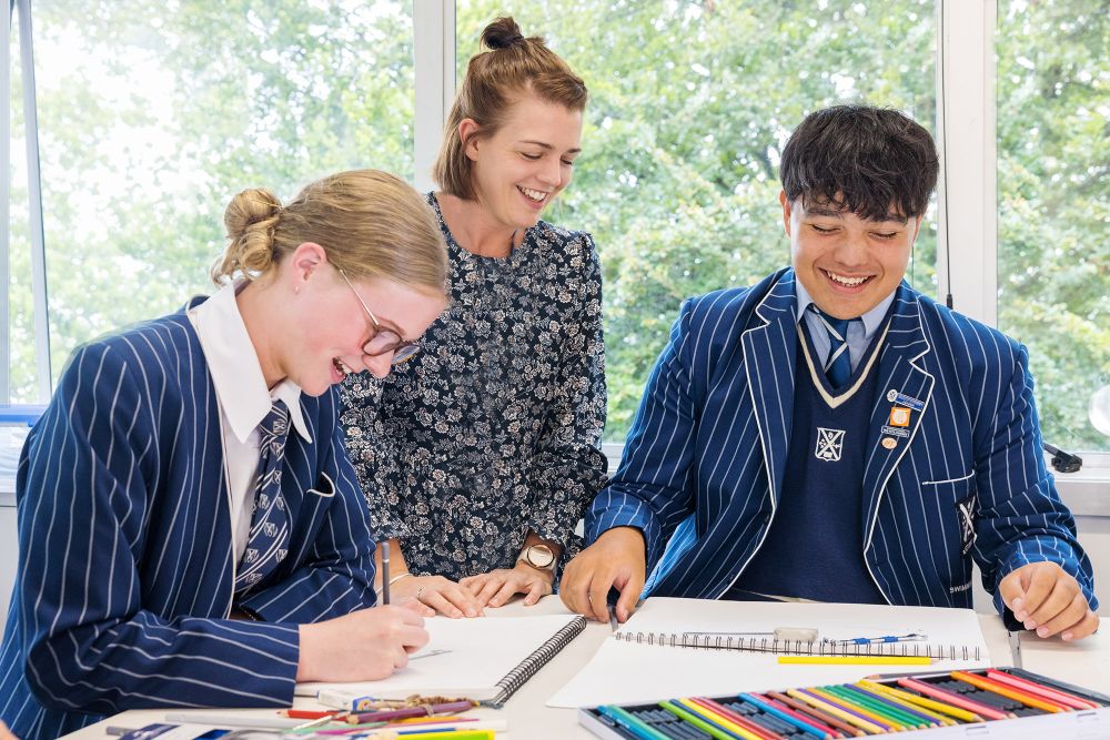 Teacher and students in art class.