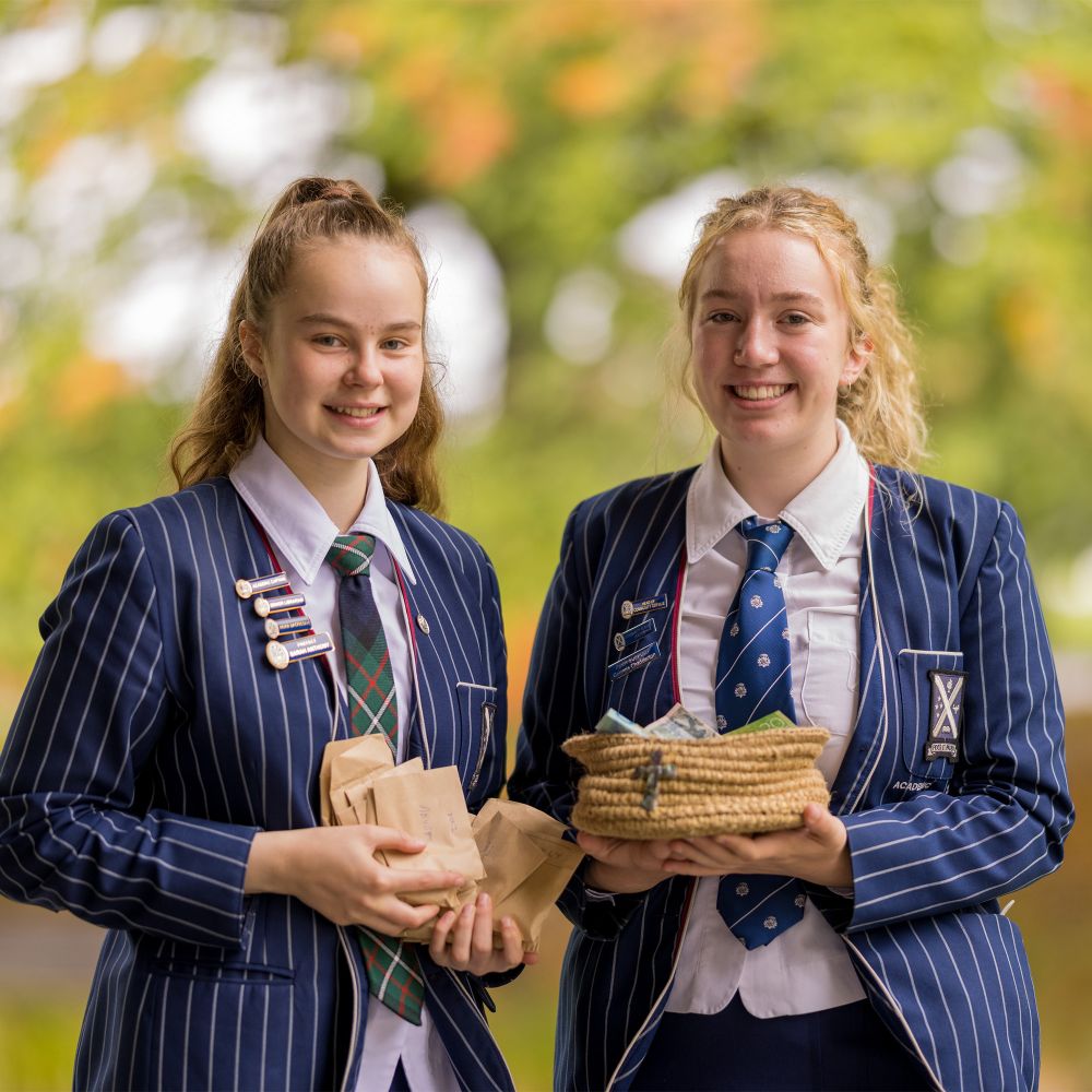 Community service leaders with donations.