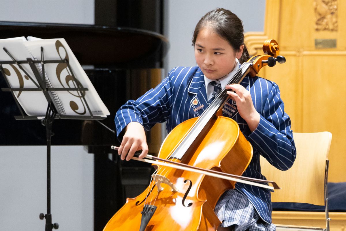 Preparatory cellist performing in the Centennial Chapel