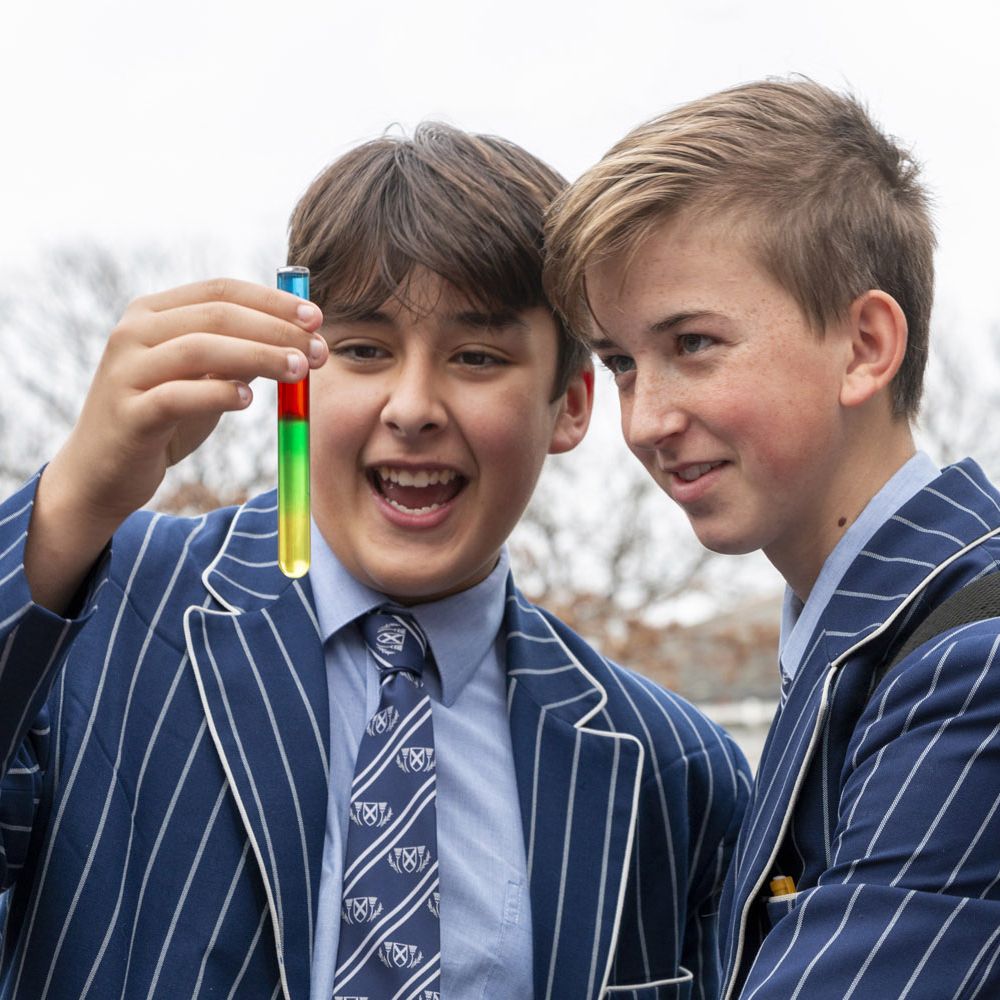 Middle School students in the quad doing science experiment.