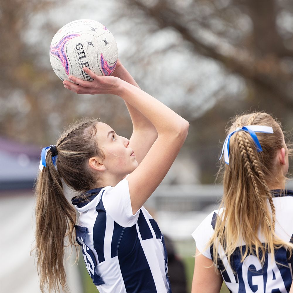 Year 9 netball team playing.