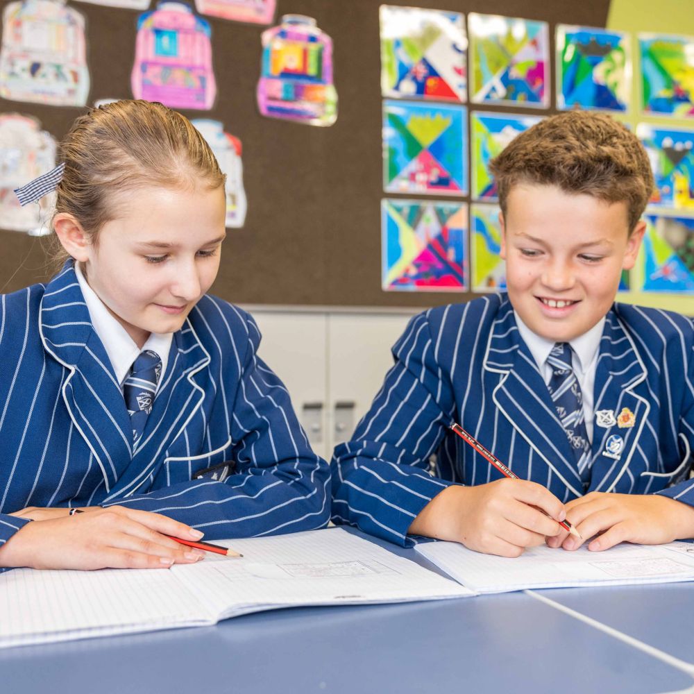Two St Andrew's College Preparatory School students writing