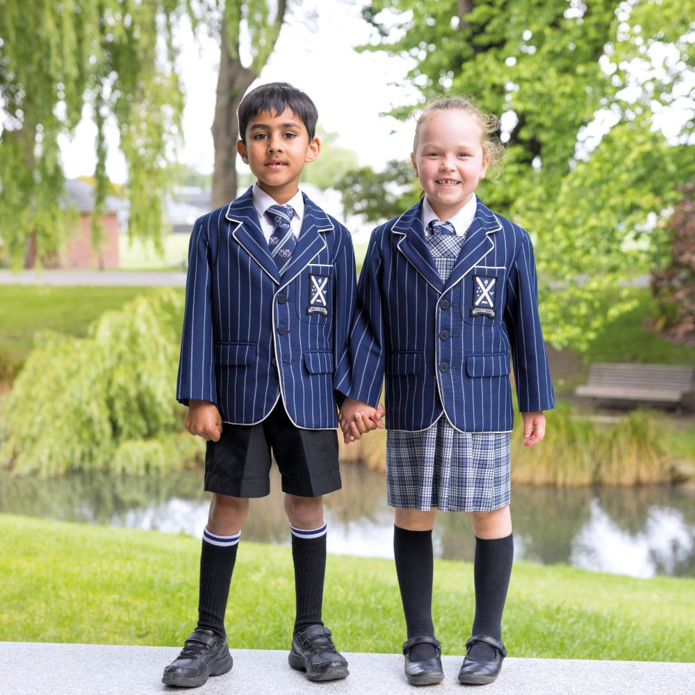 Two Preparatory students stood by the stream