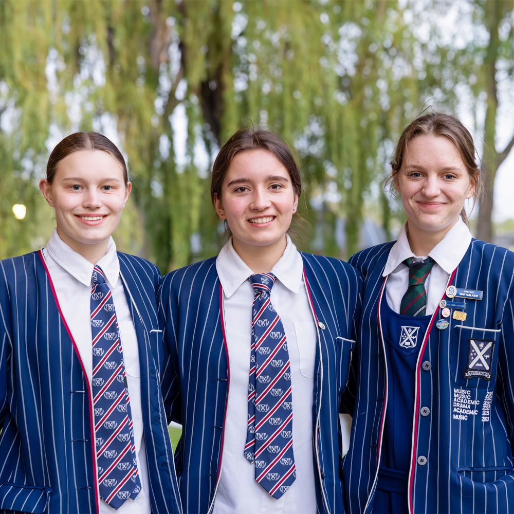 Senior College students outside chapel.