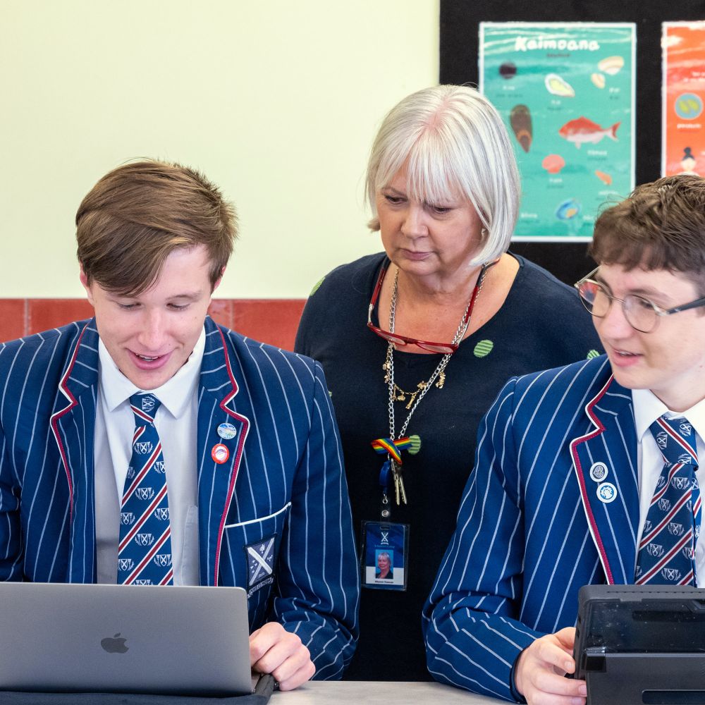 Senior College students with teacher in class.