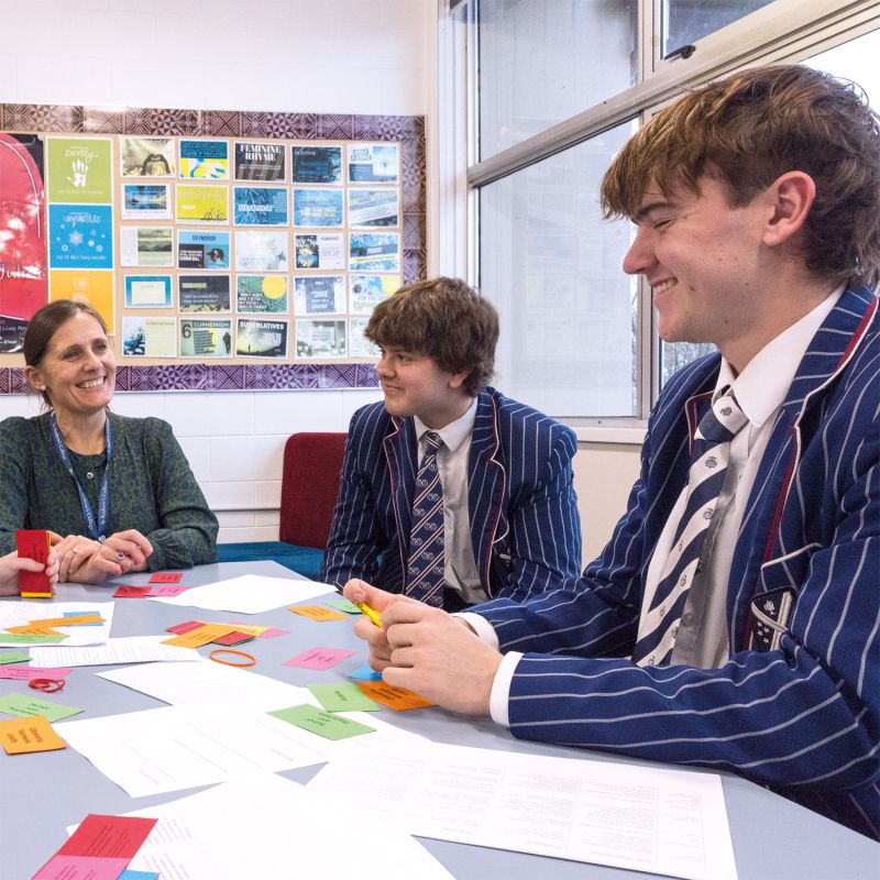 Senior College students in class with a tutor.