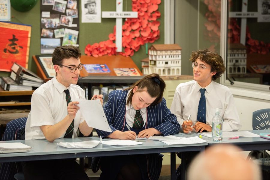 Students working in classroom together