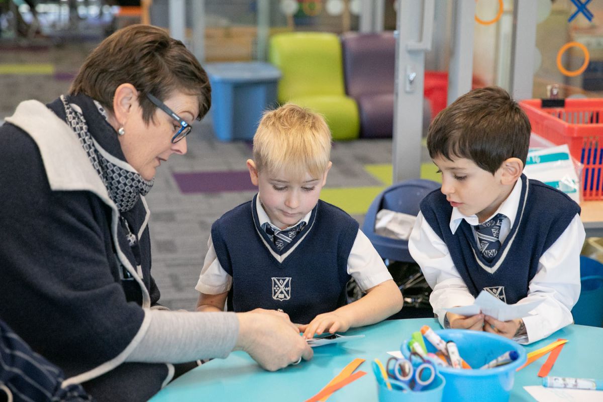 Preparatory students working with their teacher