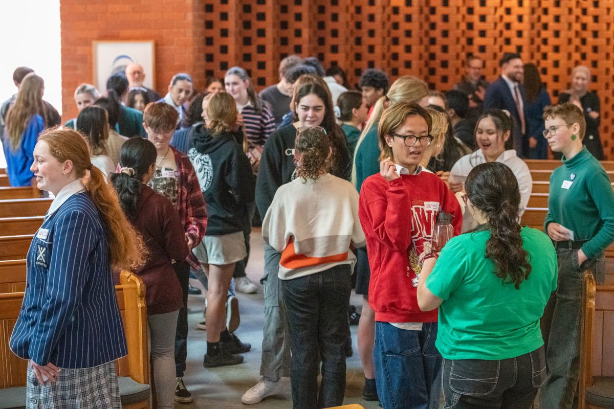 students debriefing and reflecting on conference speakers