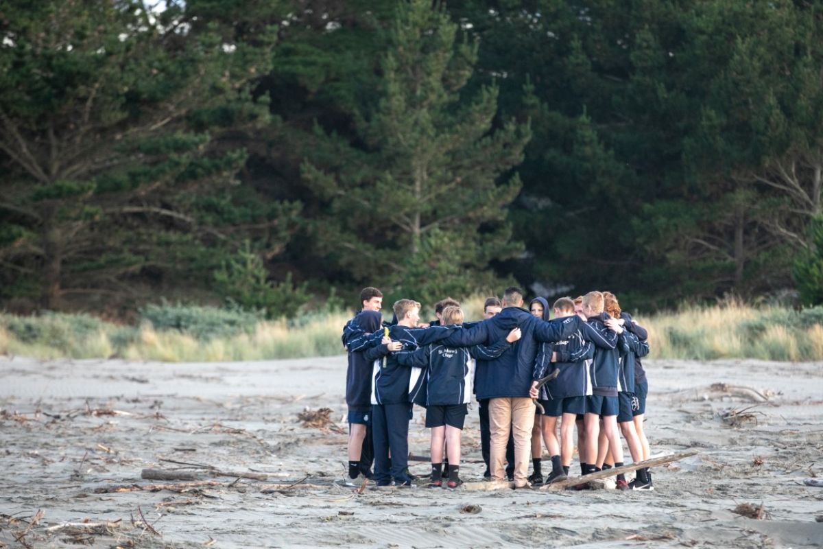 group huddle during the te waka calling ceremony