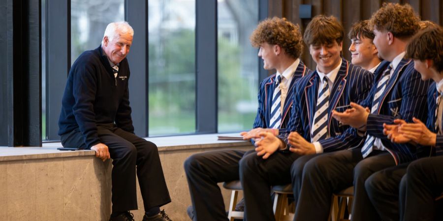 St Andrew's College 1st XV rugby coach with students at their prizegiving