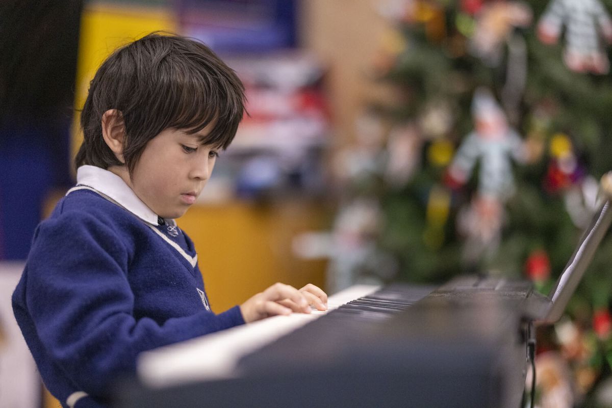 Student playing the piano