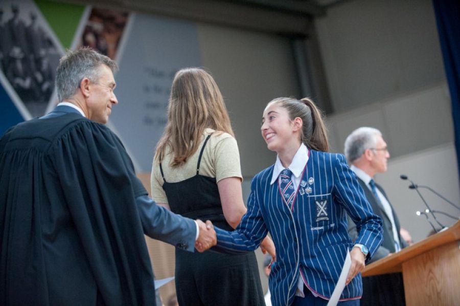 Senior student receiving an award at assembly