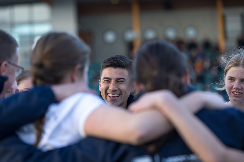 Football Co-ordinator celebrating with students.
